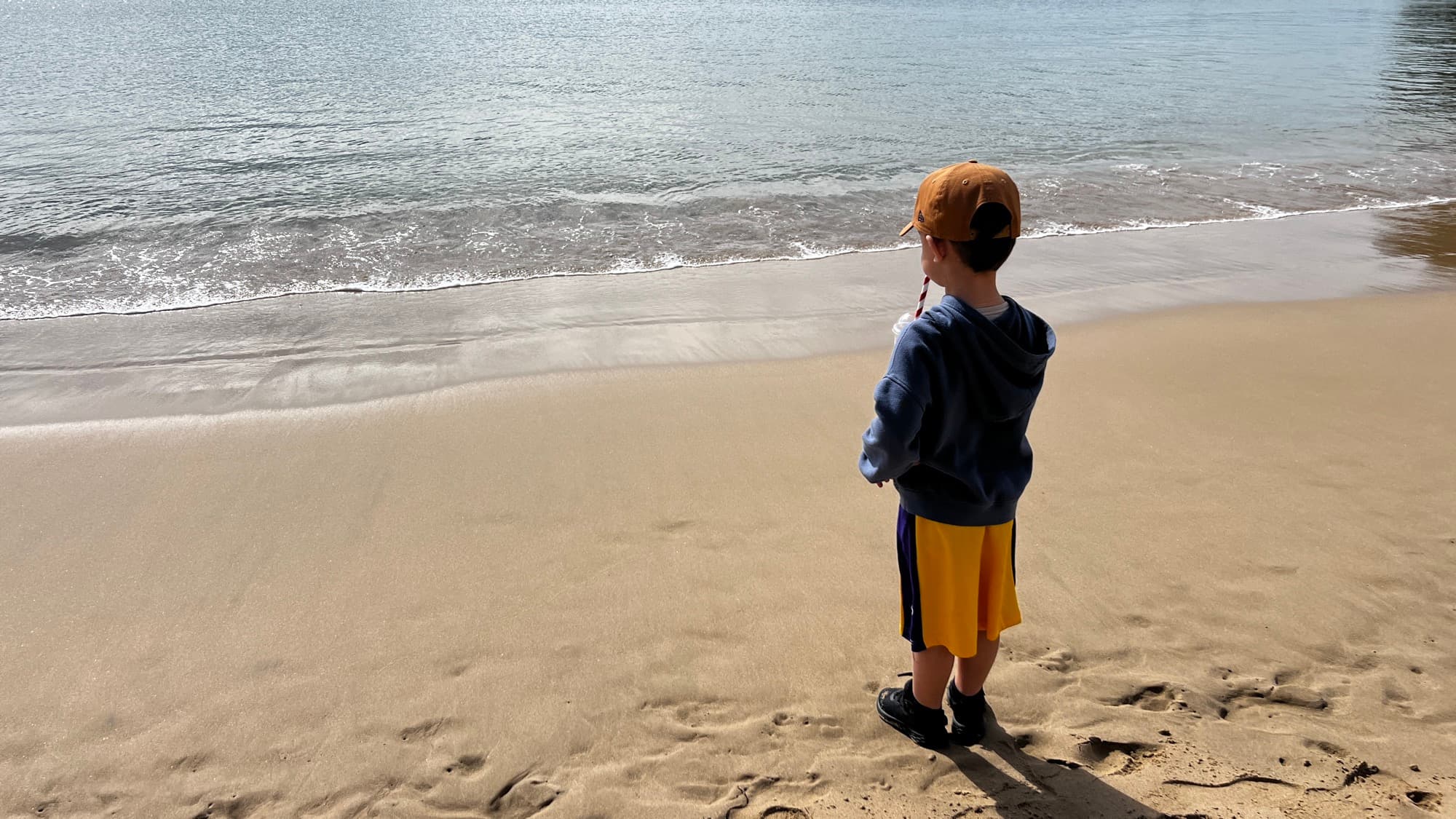 A child looking out at the water in Bundeena